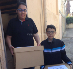  بالصور: أعضاء سرية كشافة النادي الاسلامي يوزعون طروداً غذائية على العائلات المستورة